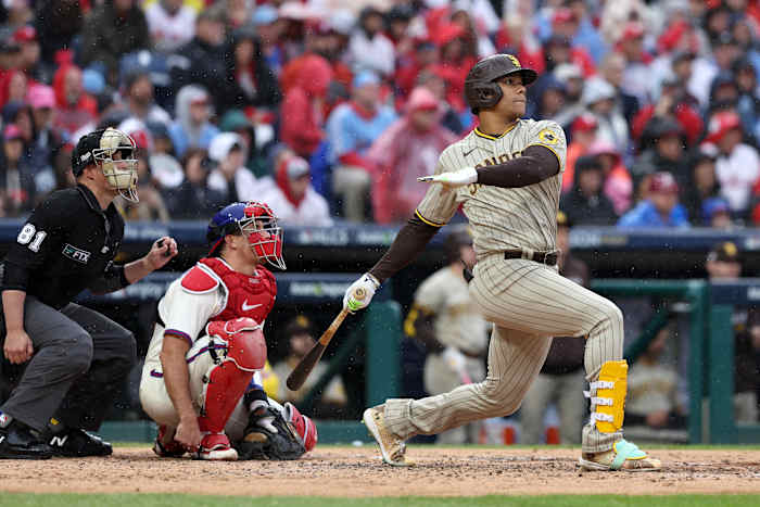 Oct 23, 2022; Philadelphia, Pennsylvania, USA; San Diego Padres right fielder Juan Soto (22) hits a solo home run in the fourth inning during game five of the NLCS against the Philadelphia Phillies for the 2022 MLB Playoffs at Citizens Bank Park. Mandatory Credit: Bill Streicher-USA TODAY Sports